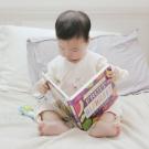 child reading a book about food