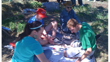 In the garden, participants sat in the shade and learned about the Food Guide Pyramid