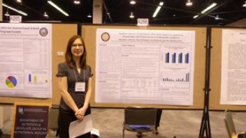CNS researcher Anna Jones with her poster at Experimental Biology.