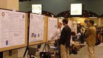 CNS researcher Eric Hazzard with his poster at Experimental Biology.
