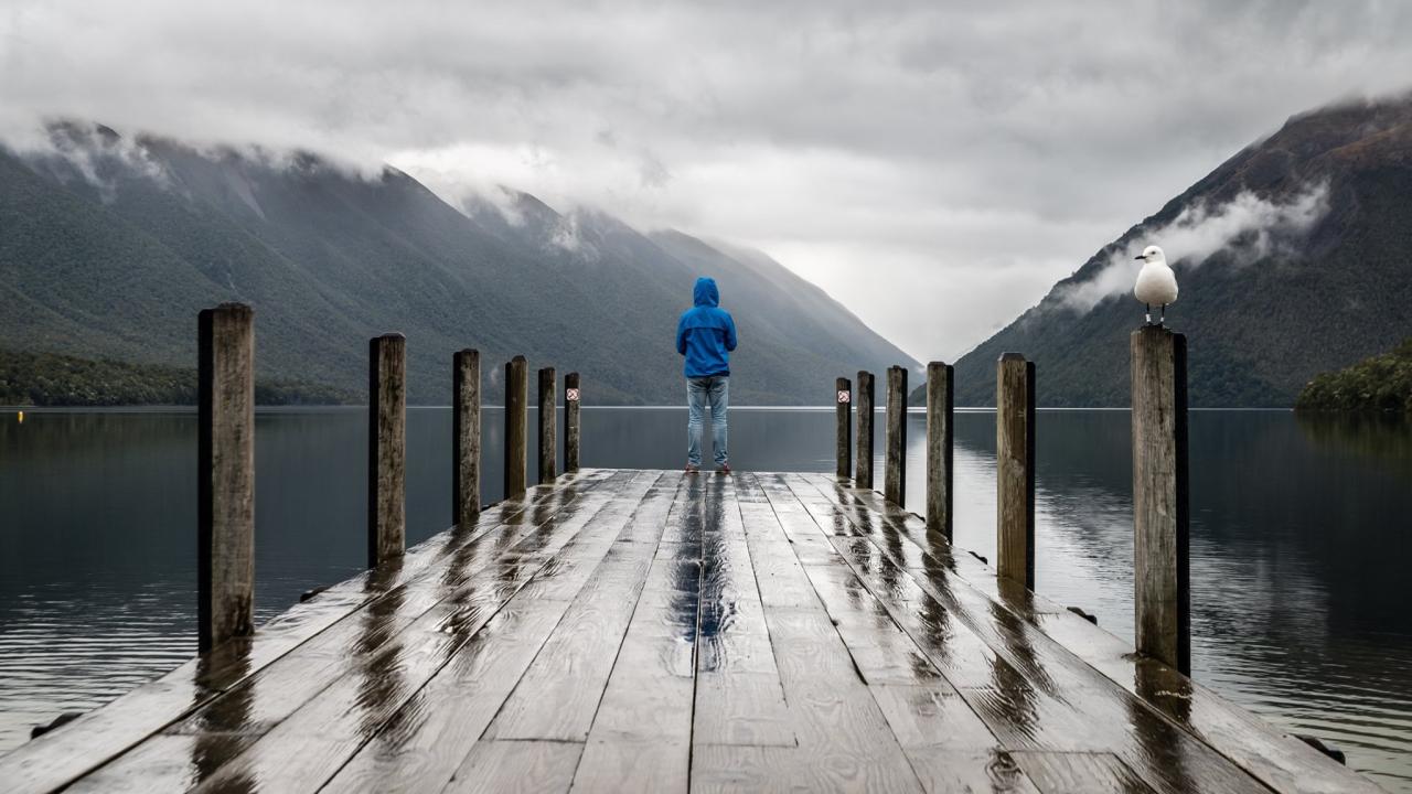 runner looking out to the landscape in the rain