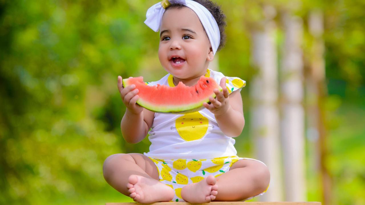 child eating watermelon