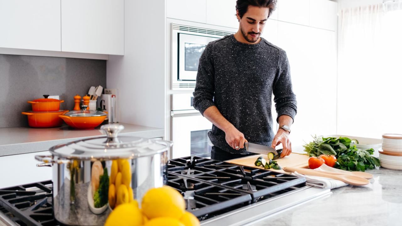 man cooking in kitchen