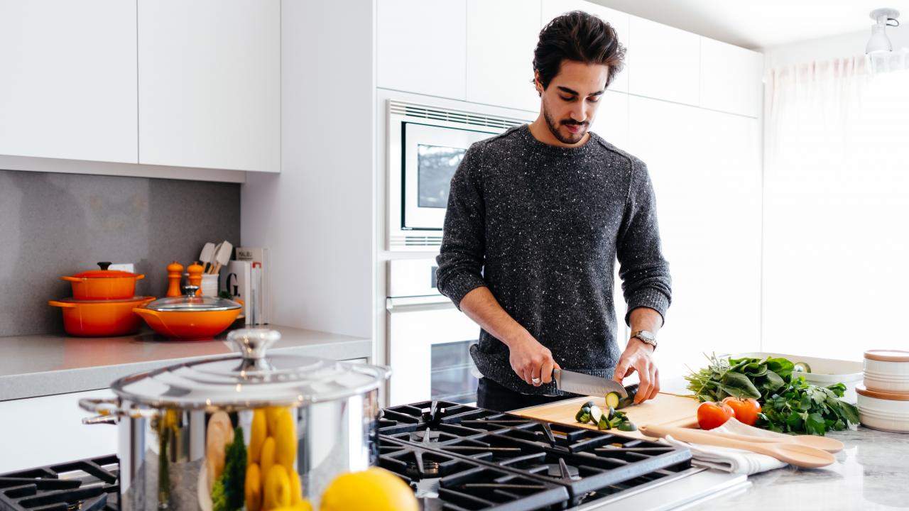 man cooking in kitchen