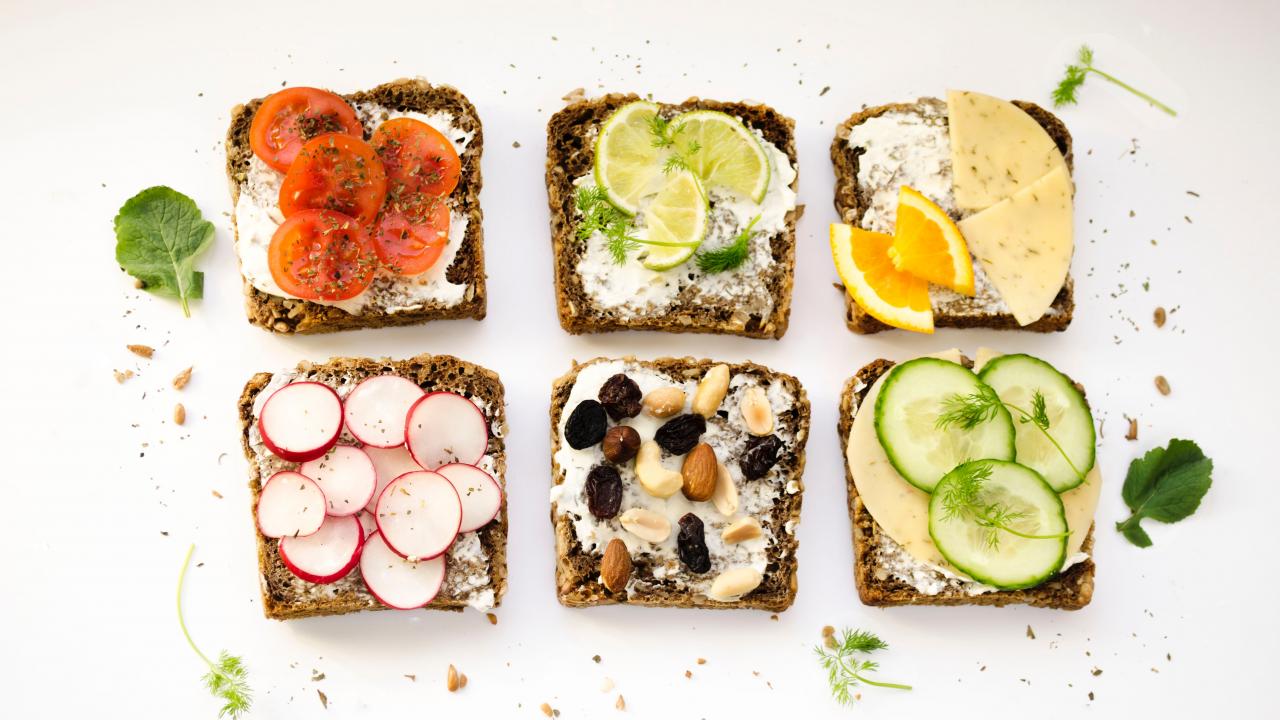 slices of bread topped with various fruit and vegetable toppings