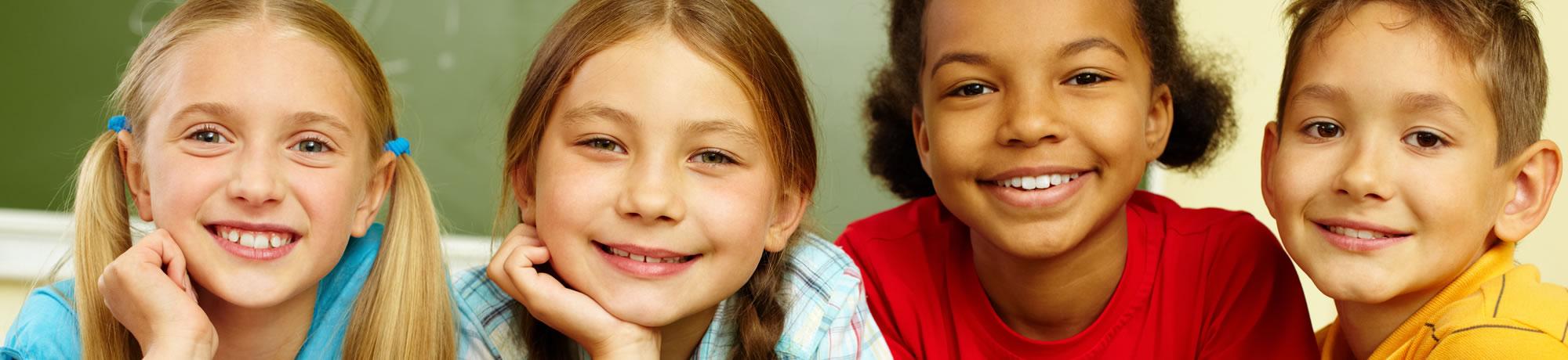 School kids smiling.